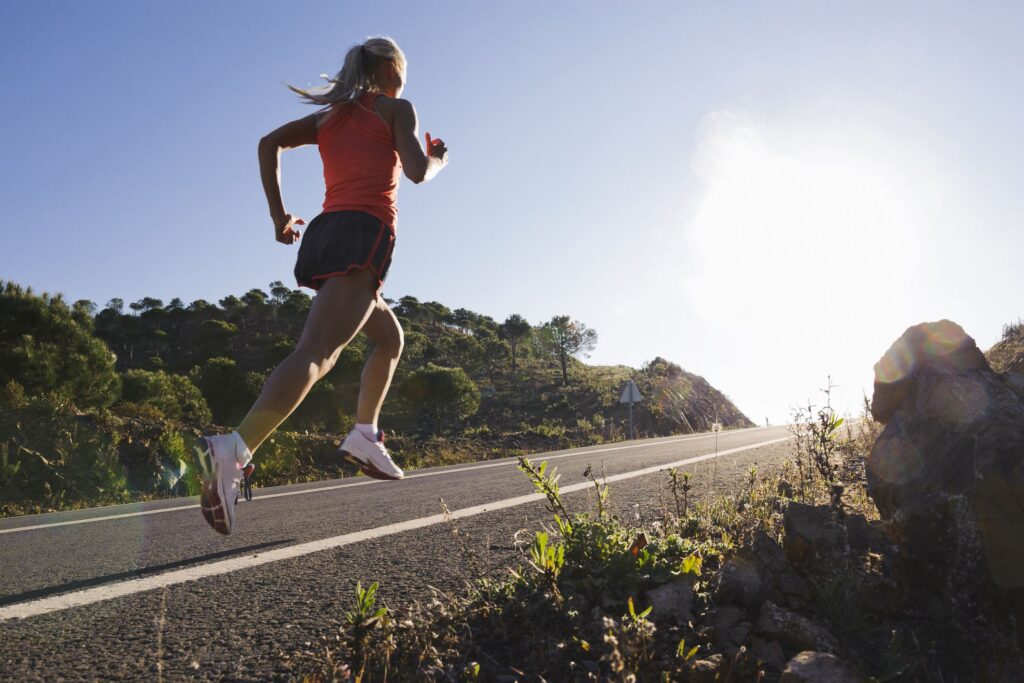 Runner practicing uphill form during hill training workout